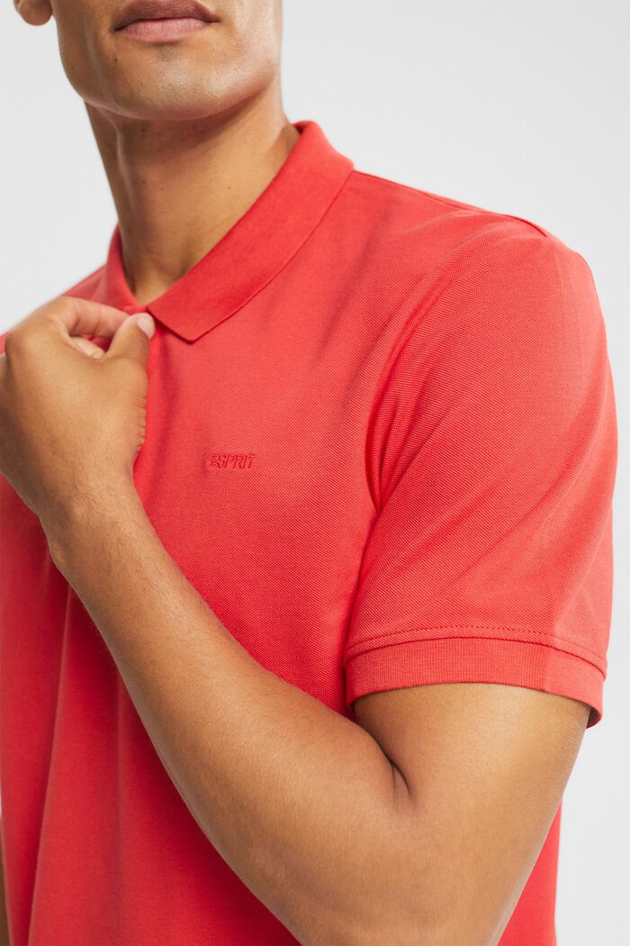 Piqué-Poloshirt aus Baumwolle, CORAL RED, detail image number 0